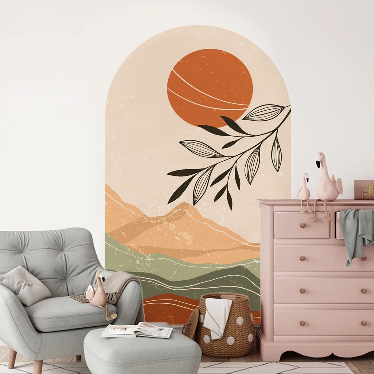 Room interior with a wall mural of a sunset and mountains, a gray armchair, and a pink dresser.