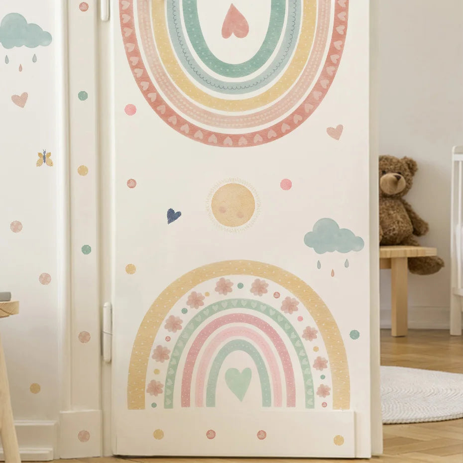 Children's room with a wardrobe decorated with pastel rainbow and heart patterns.