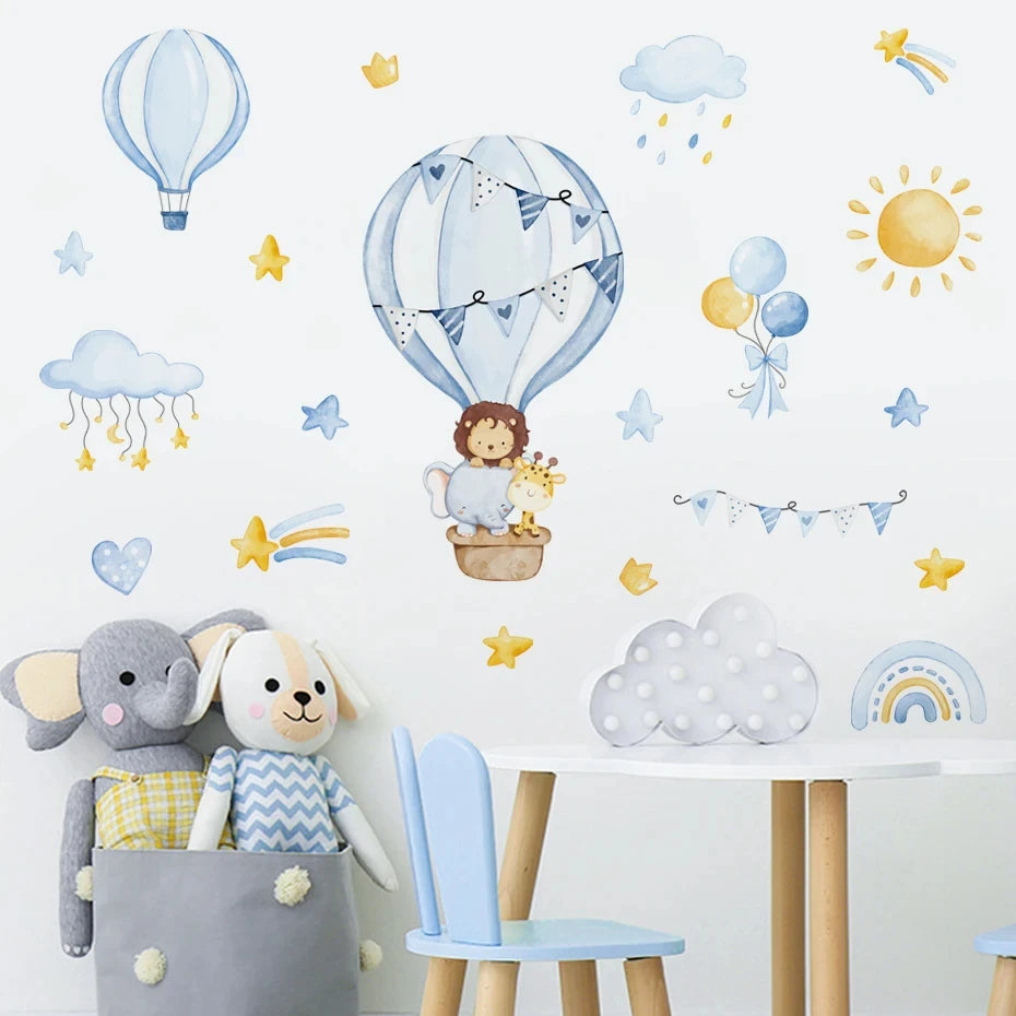 Children's room with wall stickers of hot air balloons, clouds, and animals, along with toys and a chair.