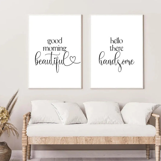 Two framed prints with 'good morning beautiful' and 'hello there handsome' text above a white sofa.