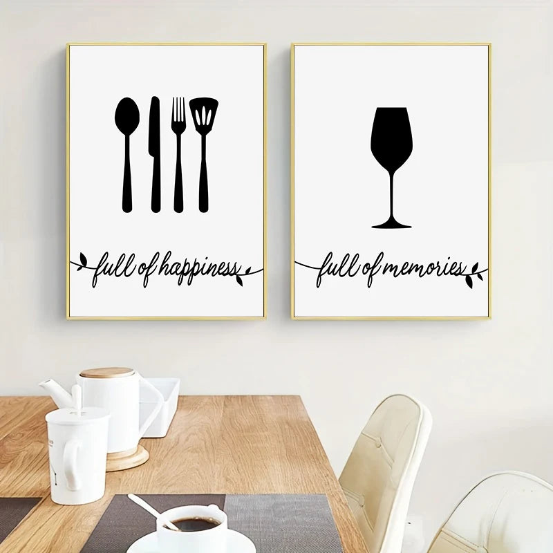 Two framed prints with kitchen utensils and wine glass silhouettes on a wall above a table.