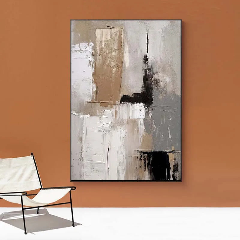 Abstract painting on an orange wall with a chair below