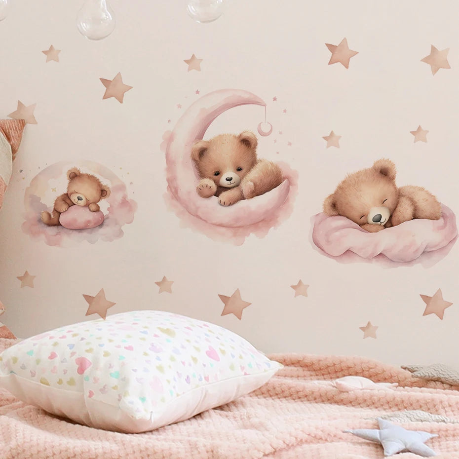 Children's room with teddy bear wall decals and a pink blanket.