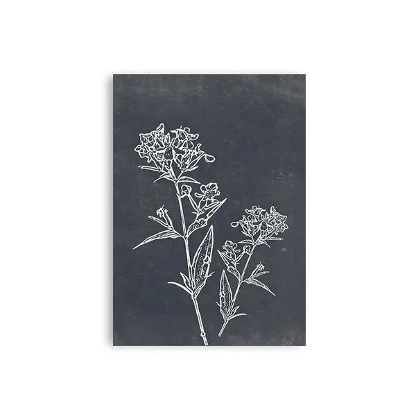 Black slate tile with white floral design on a white background