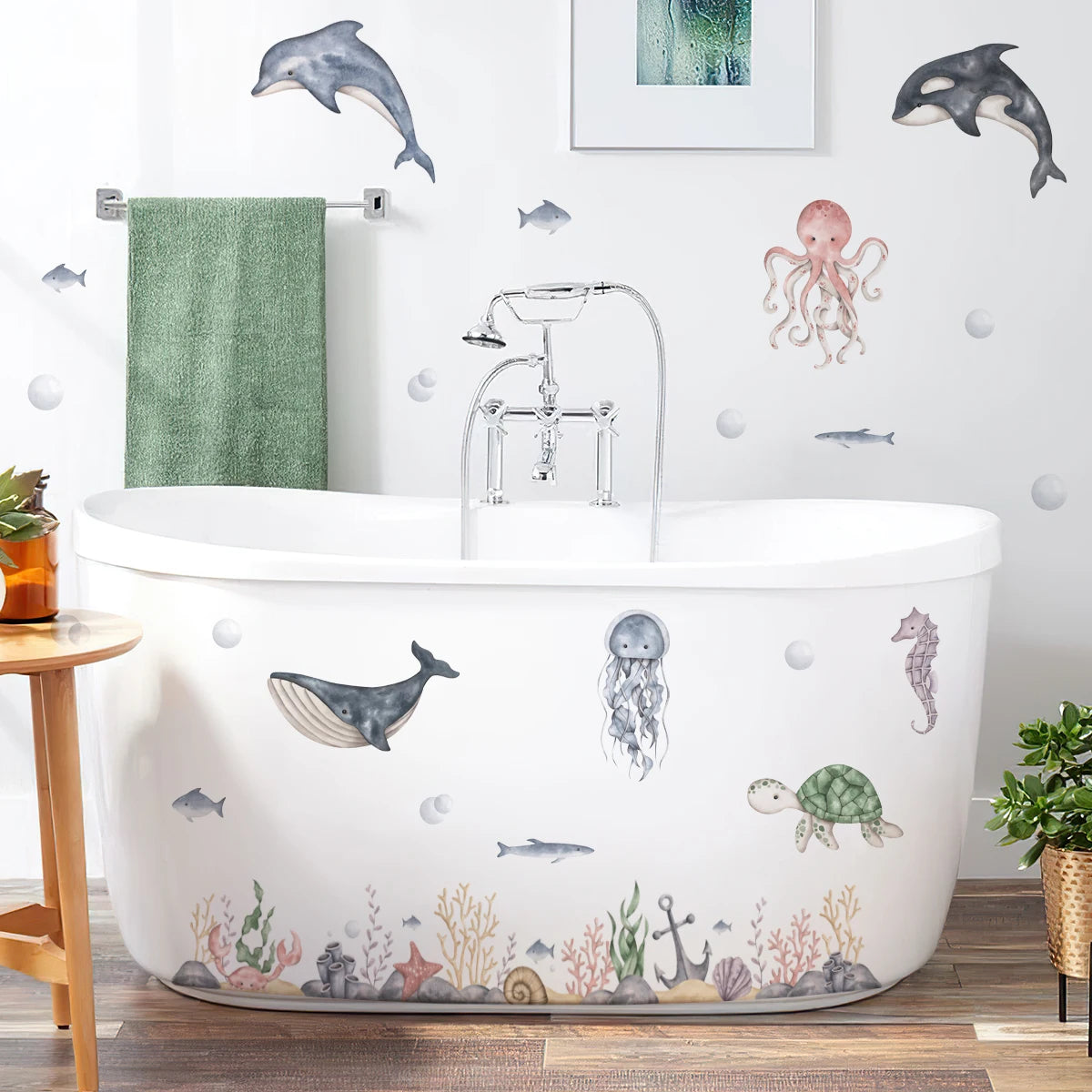 Bathroom with a bathtub decorated with underwater-themed stickers, including dolphins, fish, and seahorses.