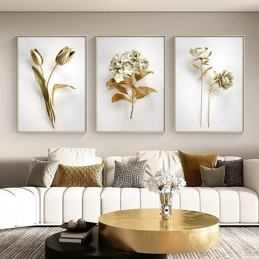 Decorative floral wall art above a white sofa with a gold coffee table.