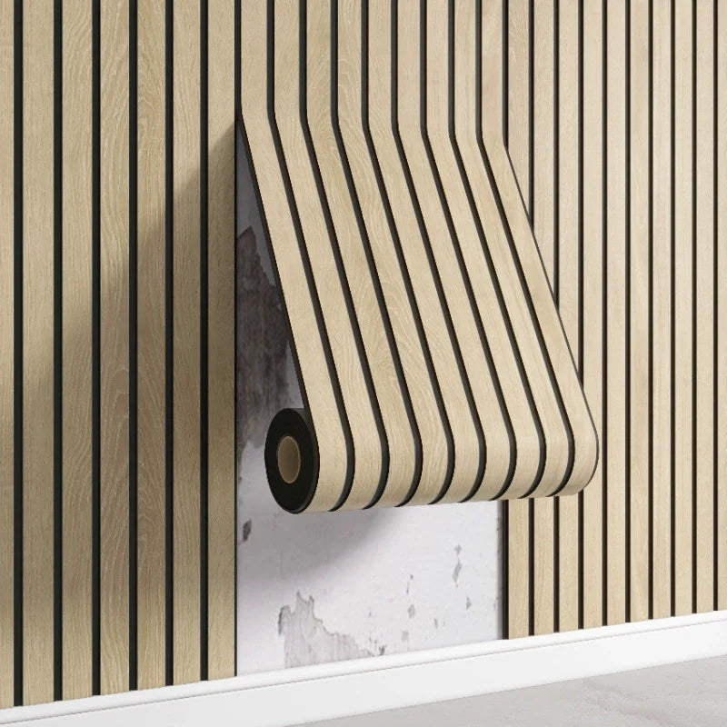 Roll of wallpaper with beige and black striped pattern on a wooden surface