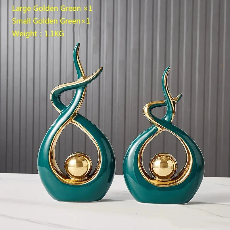 Two decorative vases with gold accents on a plain background