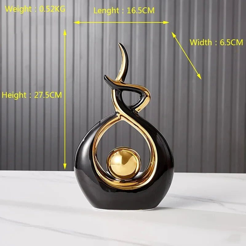 Decorative black and gold sculpture with measurements on a gray background