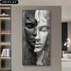 A large vertical black and white canvas wall art print featuring a sculptural face split into dark and light halves, displayed on a beige wall in a modern living room setting.