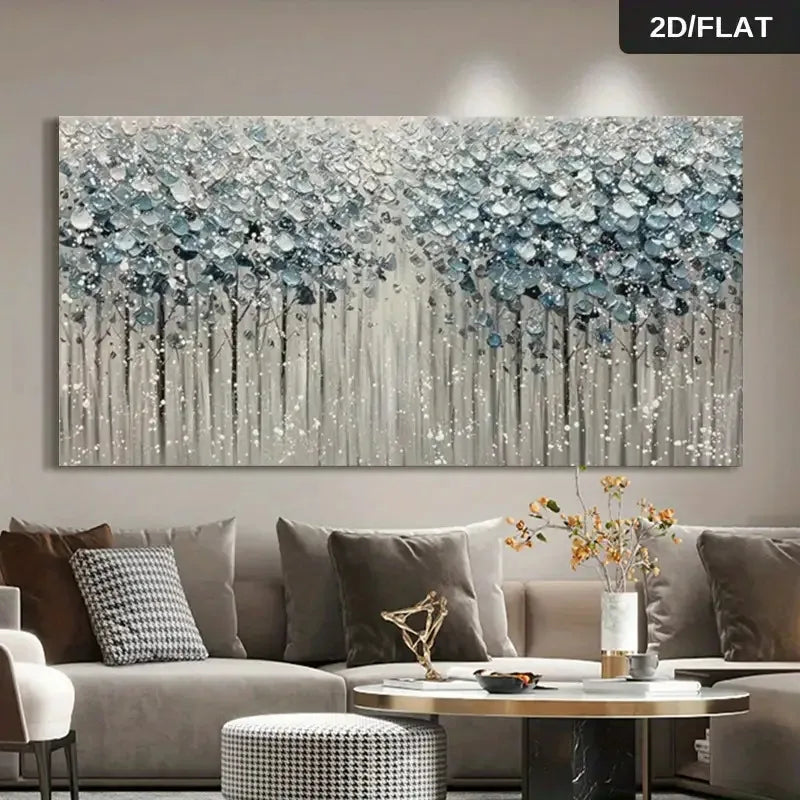 A large rectangular wall art piece showing an abstract forest scene in blue, white, and gray tones, displayed above a sofa in a modern living room. The image includes a '2D/FLAT' label in the top right corner.
