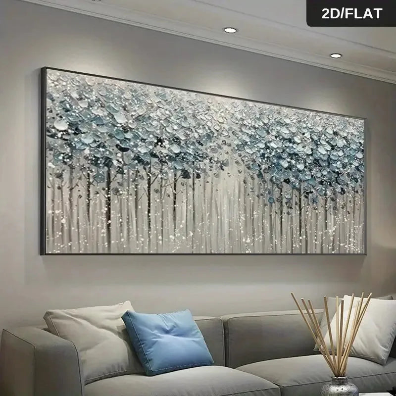 A large rectangular wall art piece showing an abstract forest scene in white, silver, and blue tones, displayed above a gray sofa in a modern living room. The image includes a small '2D/FLAT' label in the top-right corner.