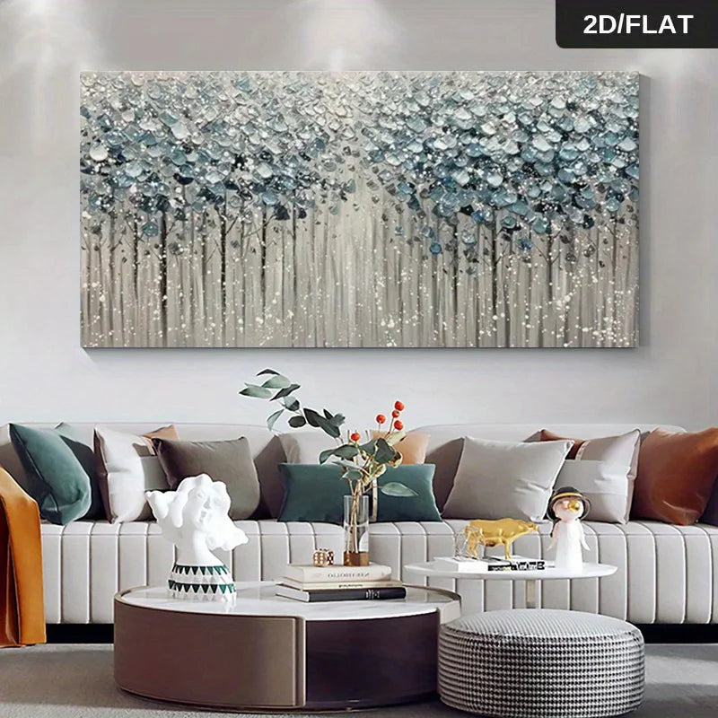 A large rectangular canvas wall art piece featuring an abstract forest scene with blue-gray and white brushstrokes, displayed above a modern sofa in a styled living room. 
