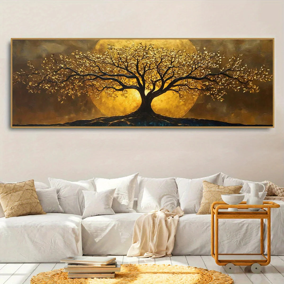 A large horizontal wall art piece showing a stylized tree with glowing golden foliage and trunk against a warm gold and brown background, displayed above a white sofa in a modern living room setting.