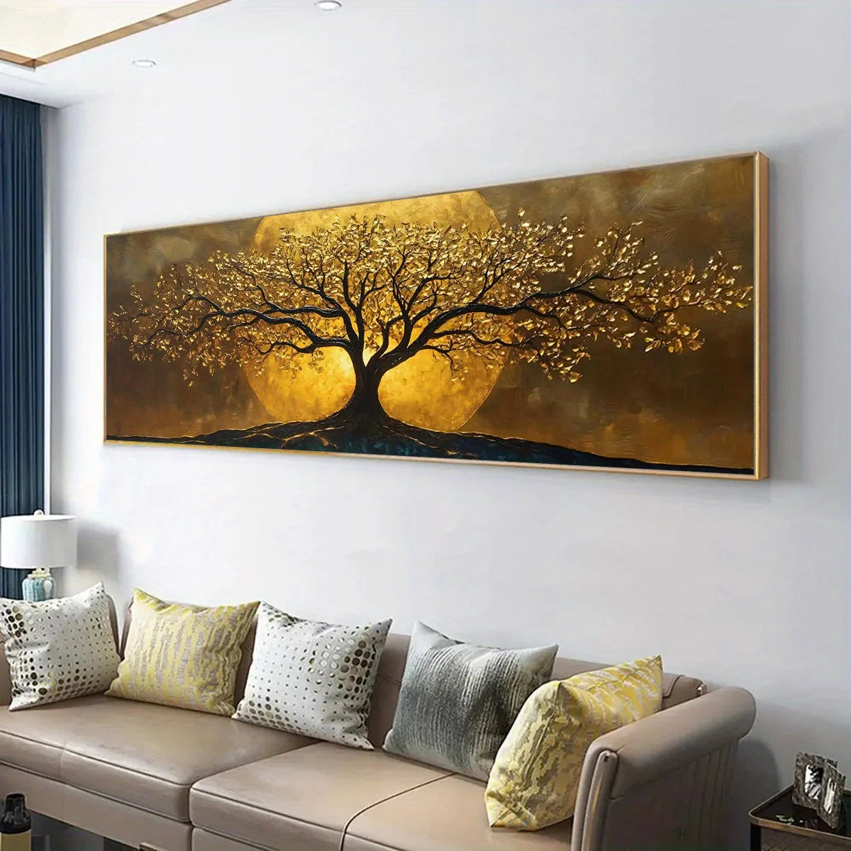 A large rectangular wall art piece showing a stylized tree with golden foliage and branches against a glowing gold and brown background, displayed above a beige sofa in a modern living room.