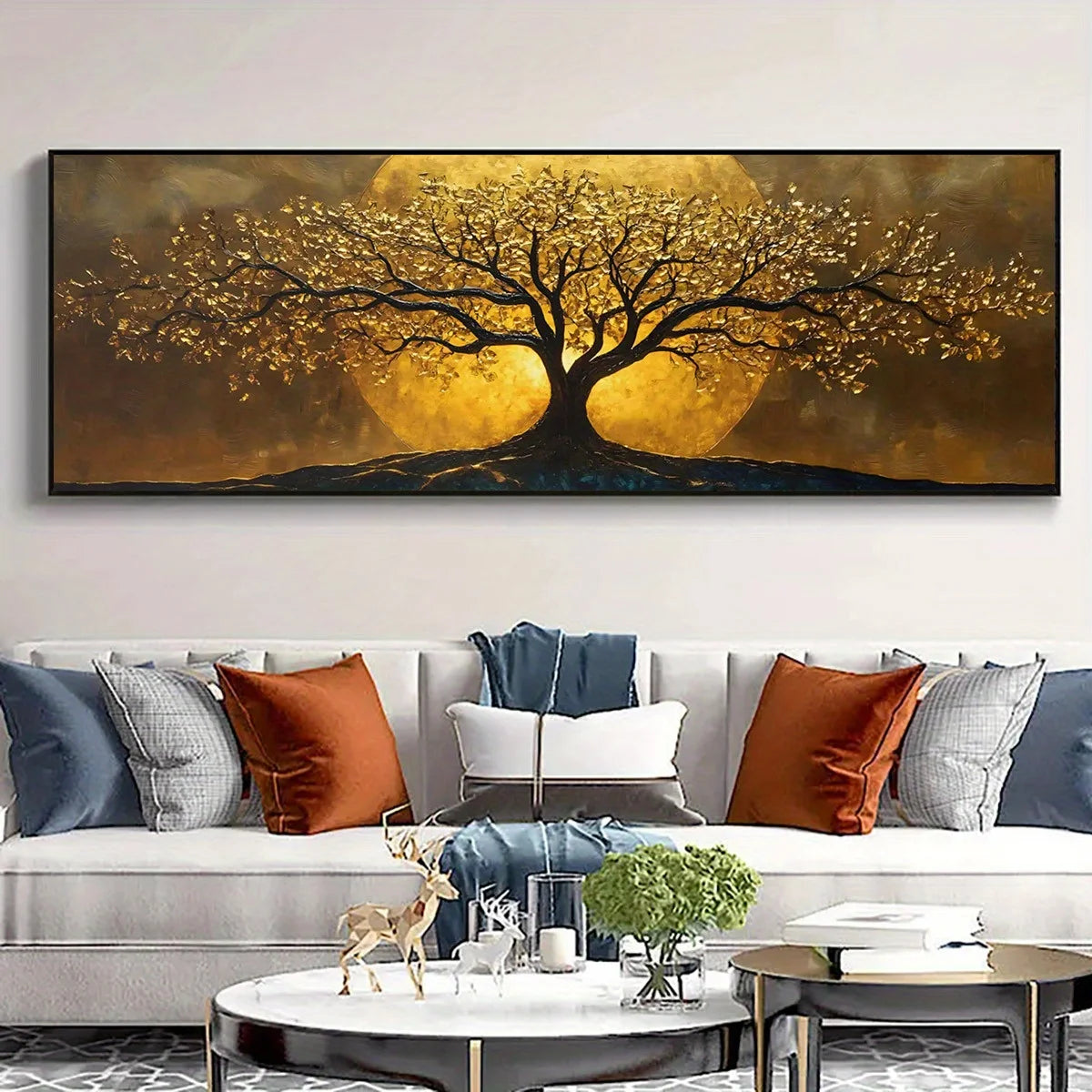 A large wall art piece featuring a stylized tree with golden-yellow foliage and a glowing yellow sun behind it, displayed above a modern light gray sofa with decorative pillows in a living room setting.