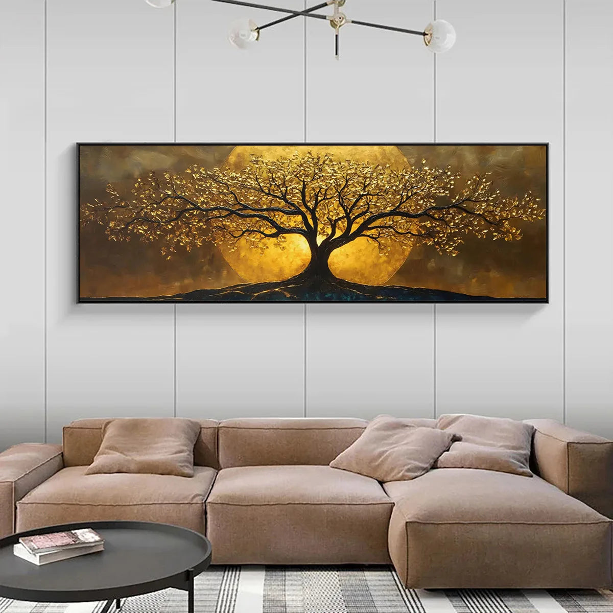 A large horizontal wall art piece showing a stylized tree with glowing golden foliage against a warm brown and gold background, displayed above a beige sectional sofa in a modern living room.
