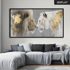 Framed artwork of two lions on a wall above a sofa in a living room.