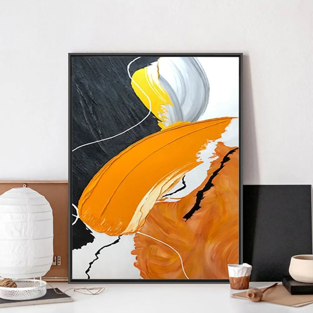 Abstract art print with orange, yellow, and white colors in a modern interior setting.