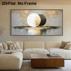 A large framed abstract wall art print hangs above a cream sectional sofa in a modern living room. The artwork features two large moon-like circles in off-white and black over a textured beige and gold background with reflective water details.