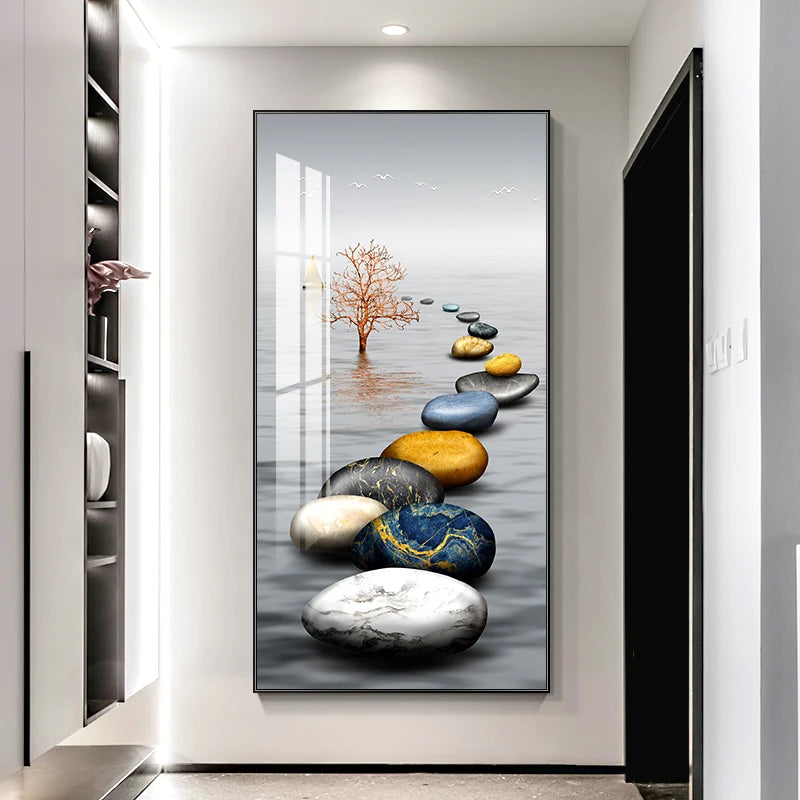 Decorative wall art of colored stones and a tree in a modern interior setting.