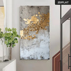 Abstract art piece with gold leaf on a textured gray background in a room setting.
