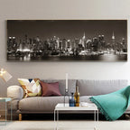 Living room with a large cityscape painting on the wall above a sofa.