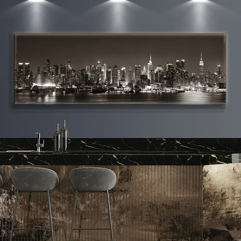 Panoramic cityscape artwork on a wall above a bar with stools.