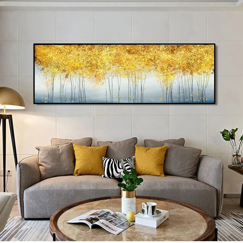 Modern living room with a gray sofa, round coffee table, and abstract painting of golden trees.