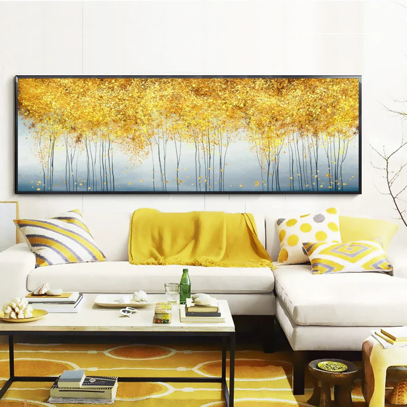 Living room with a large abstract painting of golden trees, white sofa, and decorative items.
