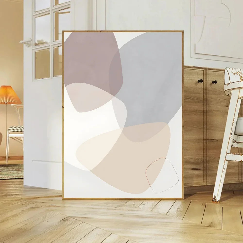 Abstract art print with geometric shapes in a minimalistic room.