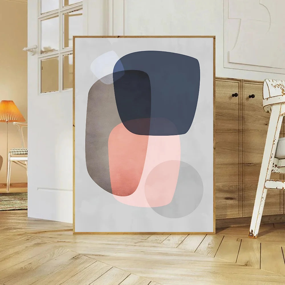 Abstract art print in a modern interior setting with wooden floor and furniture.