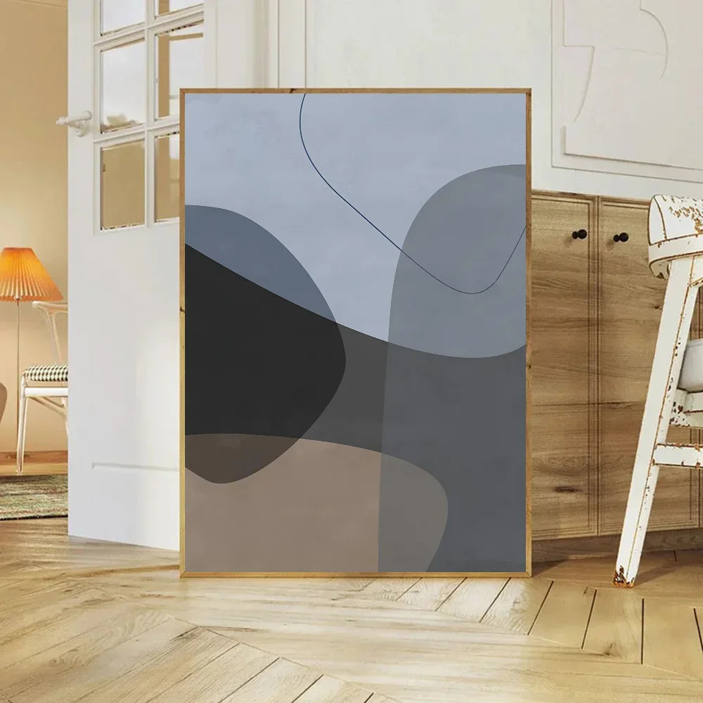 Abstract art piece with geometric shapes in a room with wooden flooring and furniture.