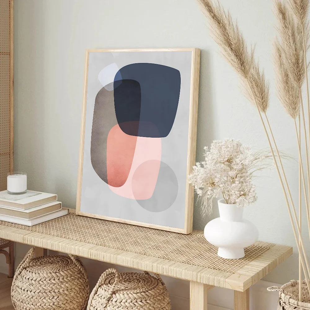 Abstract art print on a wooden table with decor elements