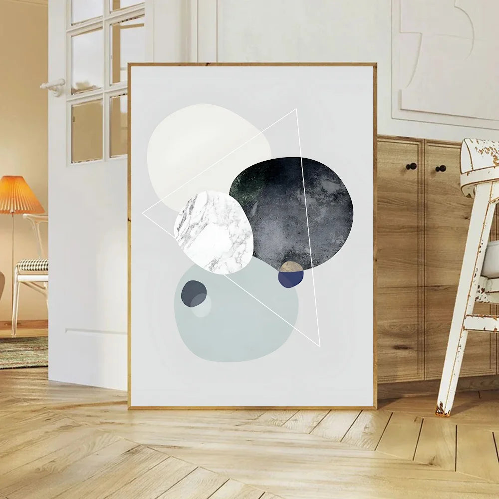 Abstract art print with geometric shapes in a modern room.