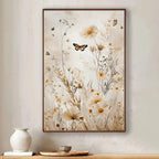 Framed floral artwork with butterflies on a wall above a wooden shelf.