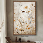 Framed artwork of flowers and butterflies on a wall with a wooden shelf below.