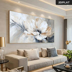 Living room with a large abstract floral painting on the wall above a beige sofa.