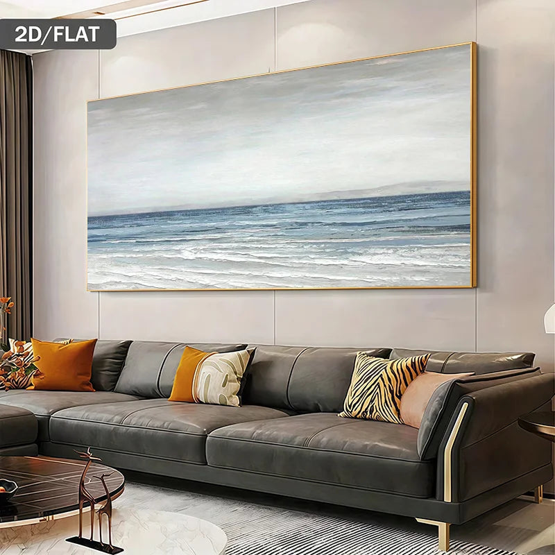 A large modern minimalist canvas print of a blue-gray ocean landscape hangs on a light gray wall above a dark gray leather sofa with accent pillows in a modern living room setting.