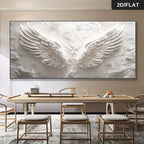 Large abstract painting of wings on a wall above a dining table with chairs.