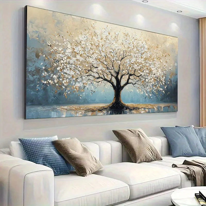 Decorative painting of a tree with white flowers on a wall above a sofa in a living room.
