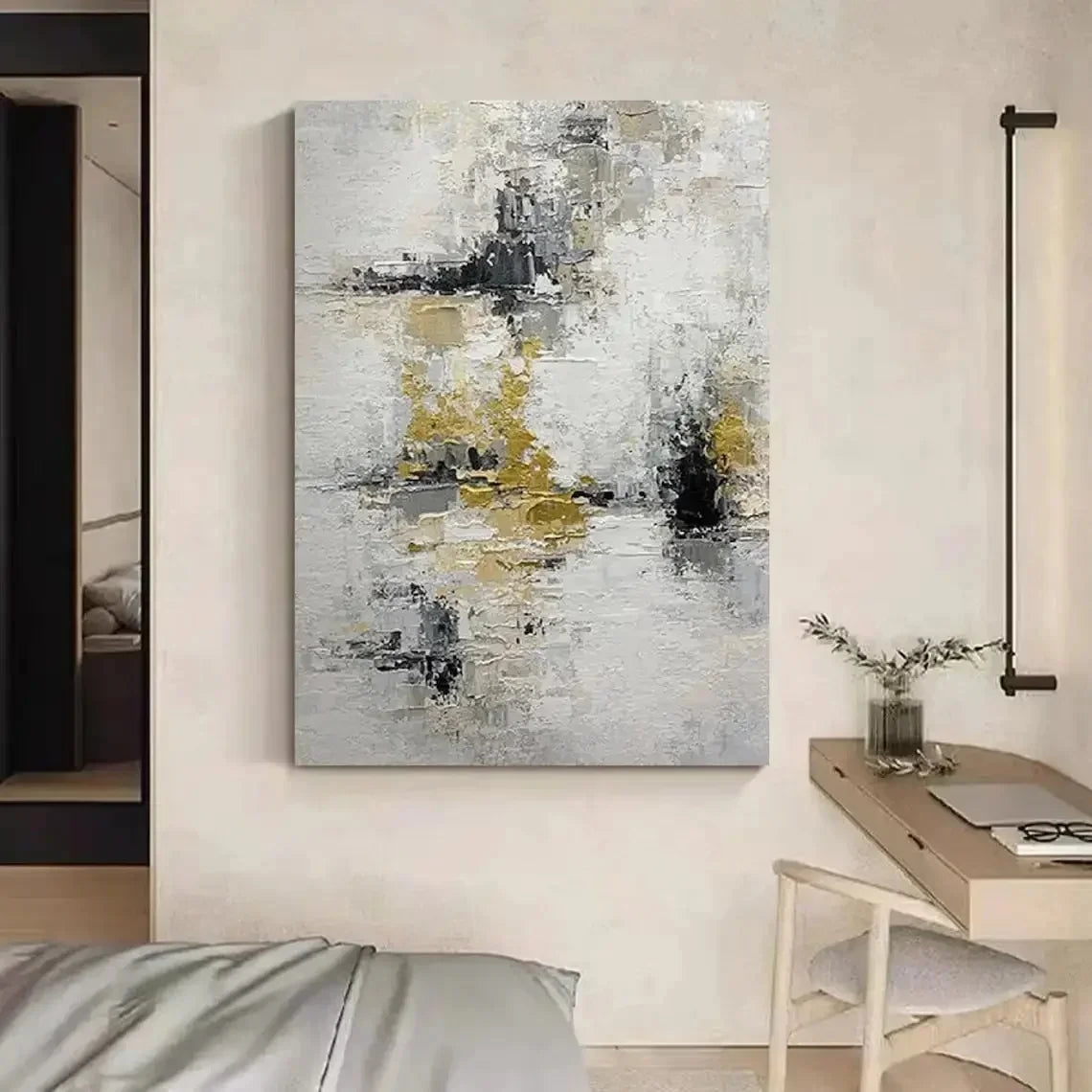 Abstract art painting in a modern interior setting with a desk and chair.