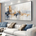 Modern living room with a large abstract painting above a white sofa.