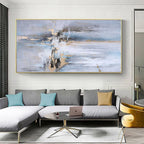 Living room with a large abstract painting on the wall above a gray sectional sofa.