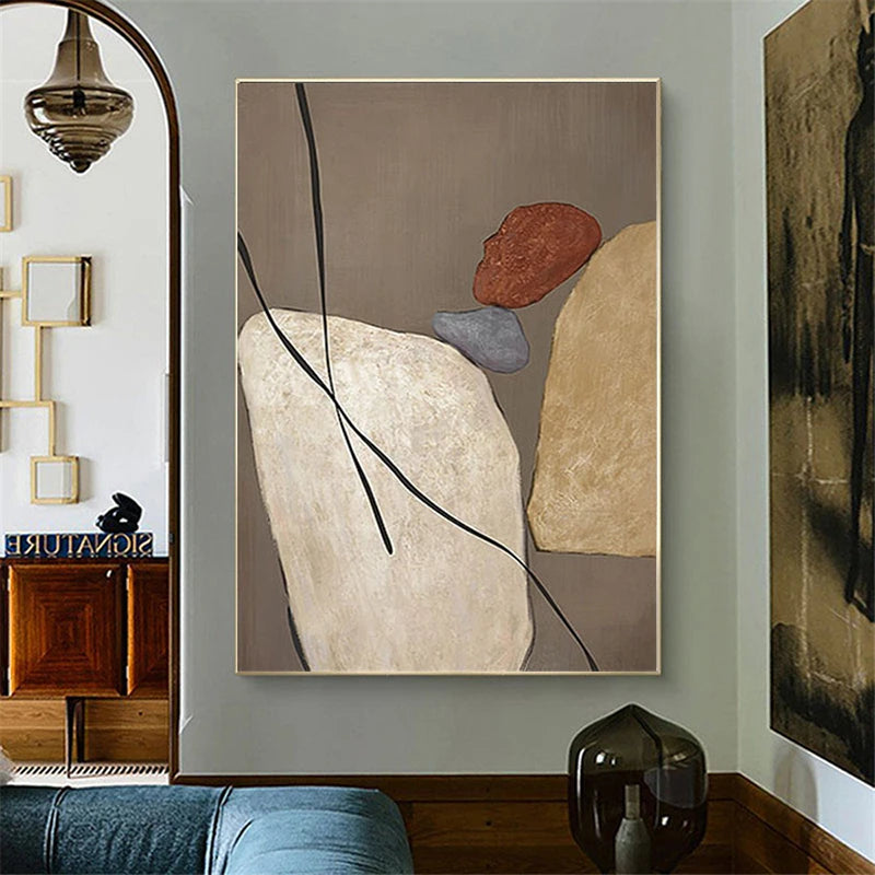 Abstract art piece on a wall with a neutral color palette