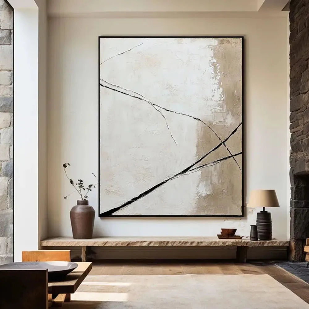 Abstract painting in a modern living room with stone walls and wooden bench.