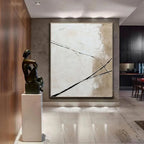 Modern interior with abstract painting and sculpture in a stylish room.