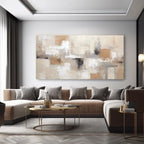Modern living room with a large abstract painting on the wall, a sectional sofa, and a coffee table.