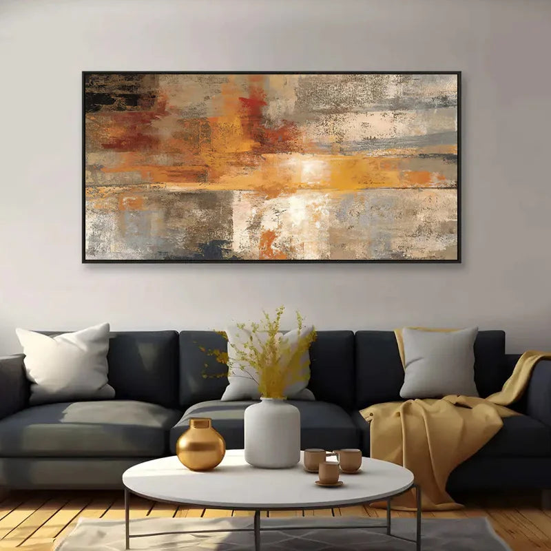 Modern living room with a large abstract painting, gray sofa, and decorative items.