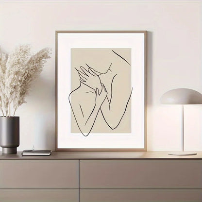 Framed line art print of hands on a wall above a cabinet with decor items.